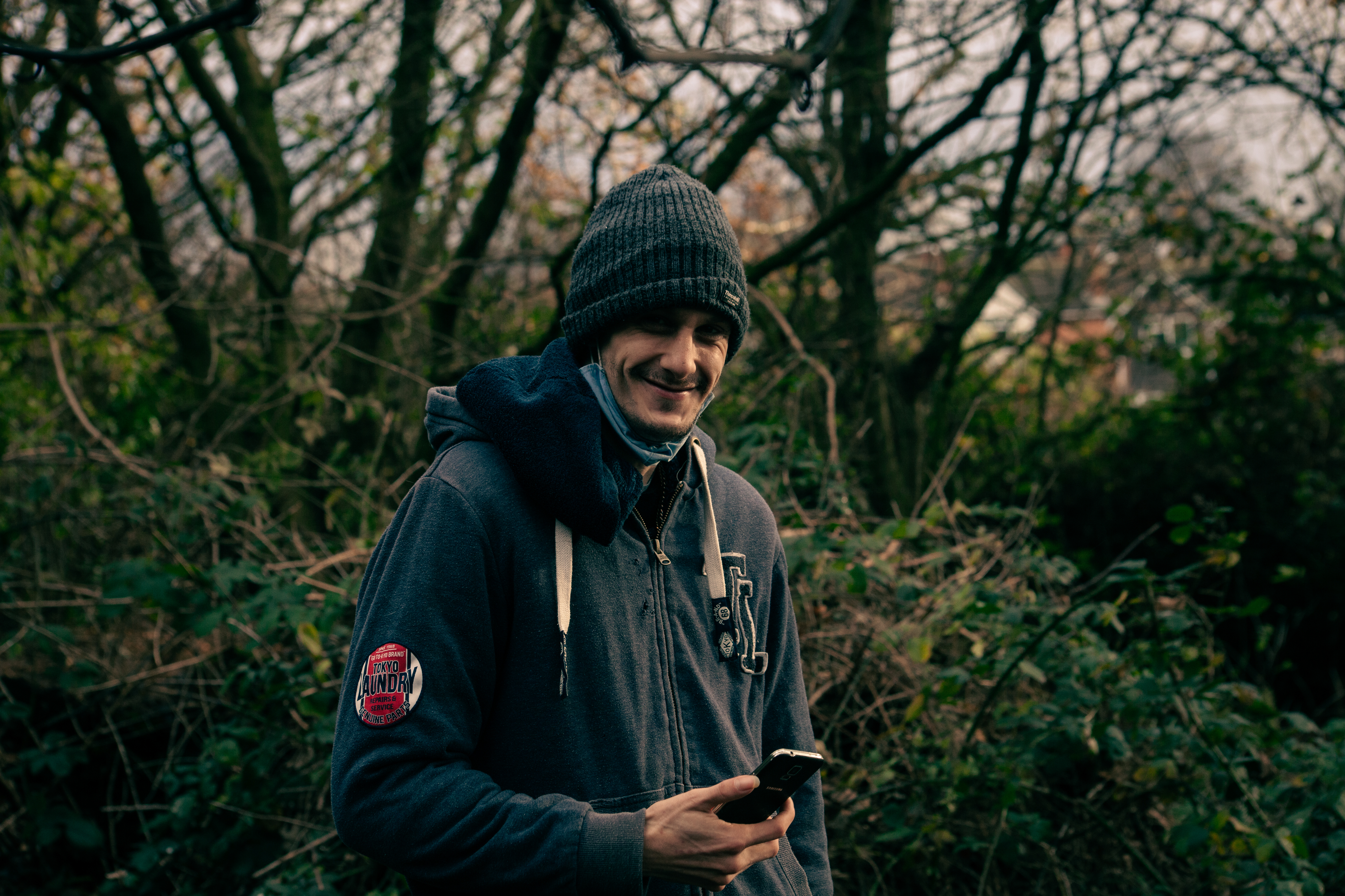 Man smiling in woodland, Man About Town Project