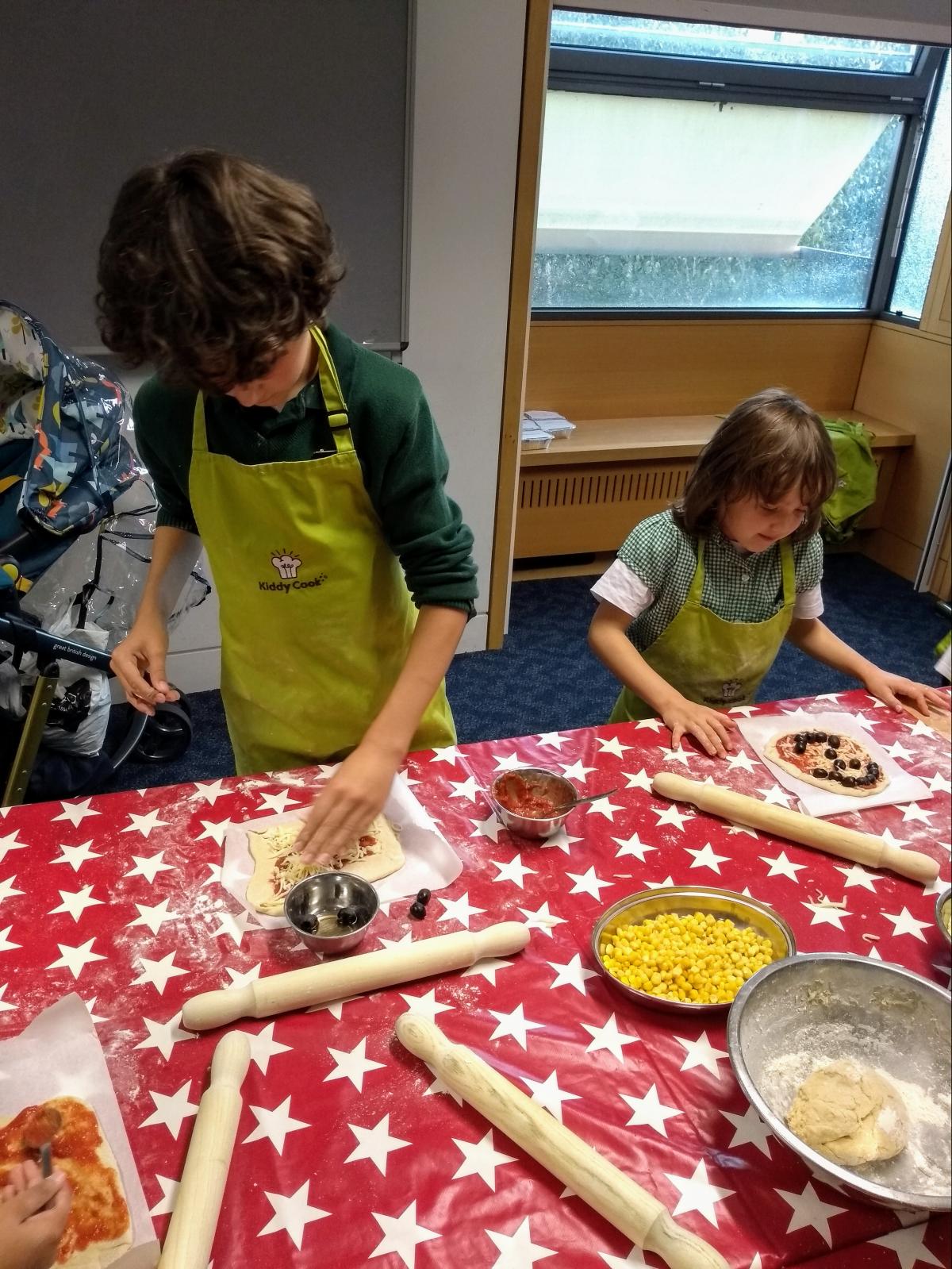 Two children cooking at Norfolk libraries