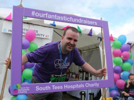 Richard celebrating after completing the Great North Run for James Cook Neuro- Rehabilitation Ward 26, Middlesborough ( South Tees Hospital NHS Trust)